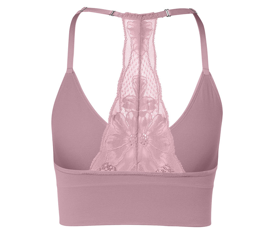 Gros plan d'une brassière de sport rose avec un dos en dentelle.