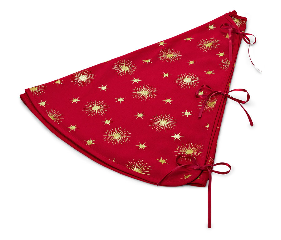 Cache-pied de sapin rouge avec étoiles dorées et rubans.