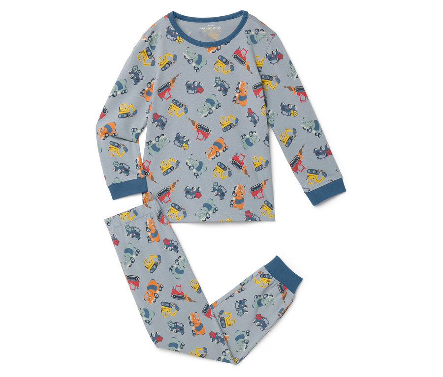 Un pyjama gris clair avec des motifs de pelleteuses posé à plat sur une surface blanche.