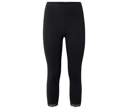 Leggings noirs avec bordure en dentelle à l'ourlet.