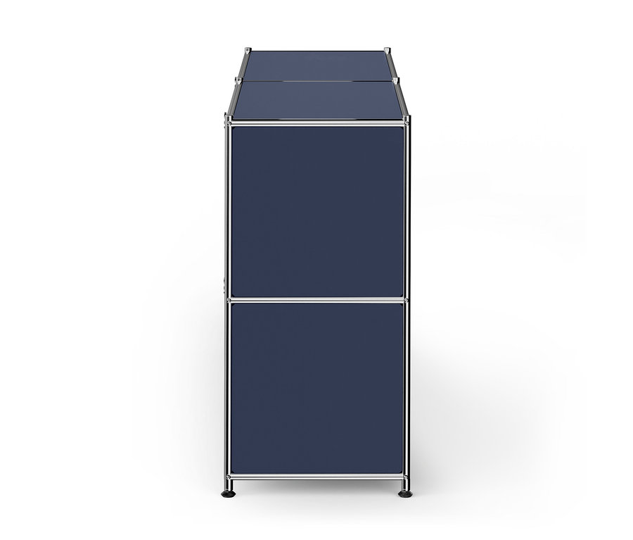Une armoire modulaire haute et étroite avec deux sections bleu foncé, un cadre argenté et des pieds sombres, vue légèrement d'en haut et de côté.