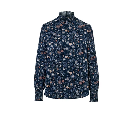 Blouse à fleurs avec col montant.