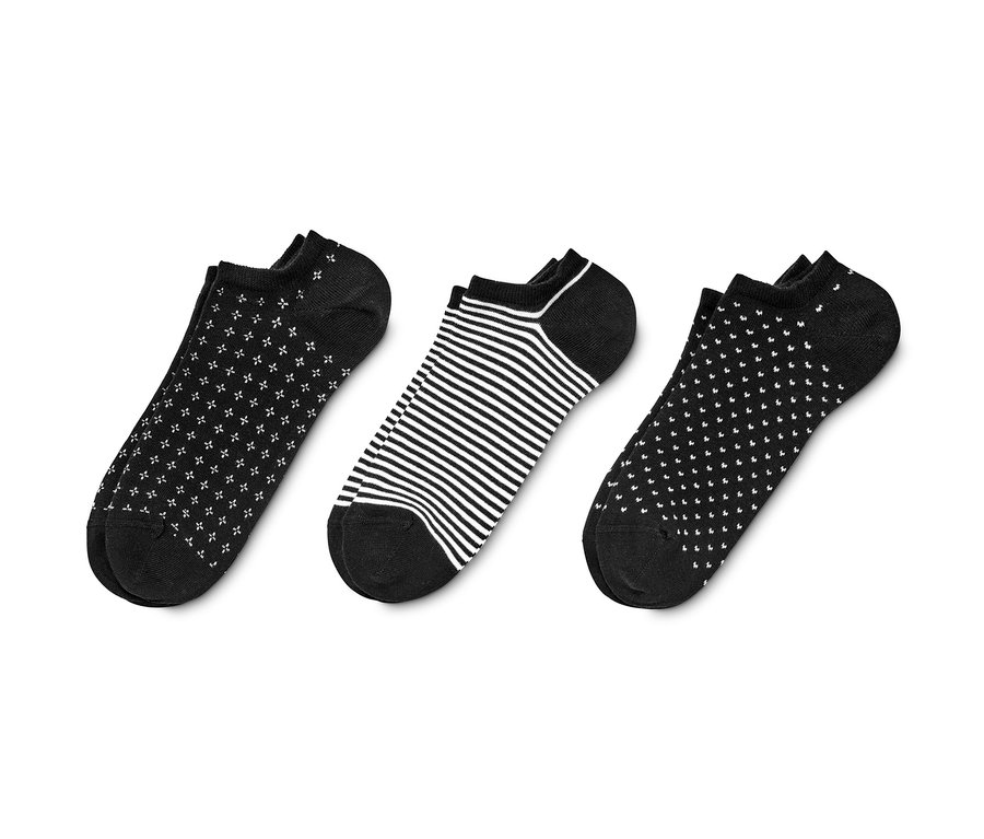 Trois paires de socquettes de sport noir et blanc.