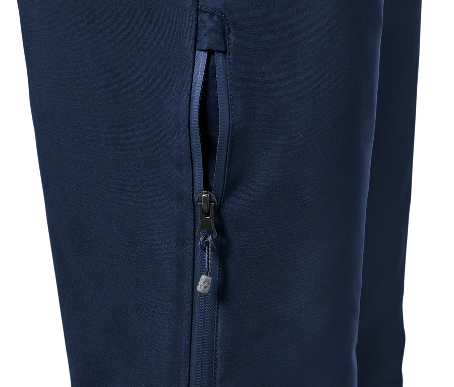 Détail d'un pantalon de ski bleu avec une fermeture éclair.