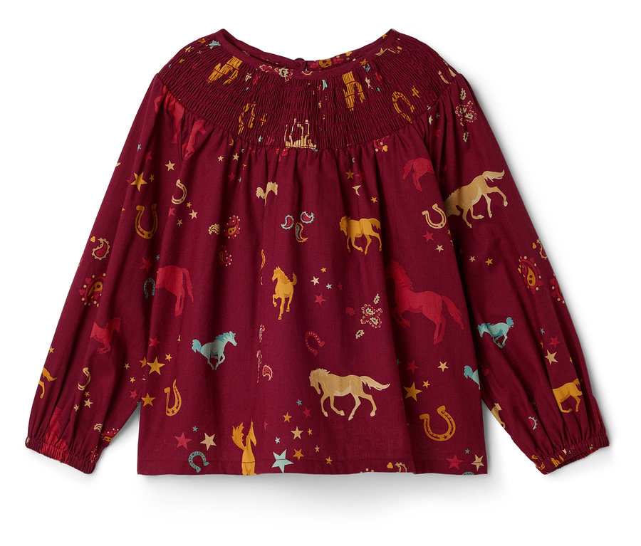 Blouse bordeaux à manches longues avec imprimé de chevaux et de fers à cheval.
