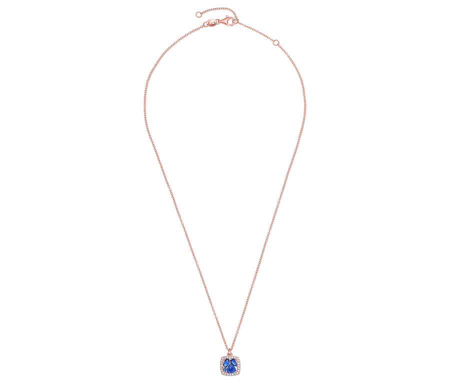 Collier avec chaîne en or rose et pendentif bleu.