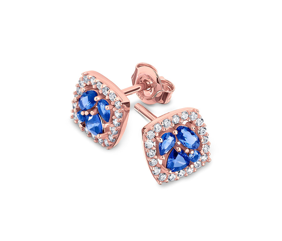 Deux boucles d'oreilles en or rose avec des pierres bleues et des zircons blancs.