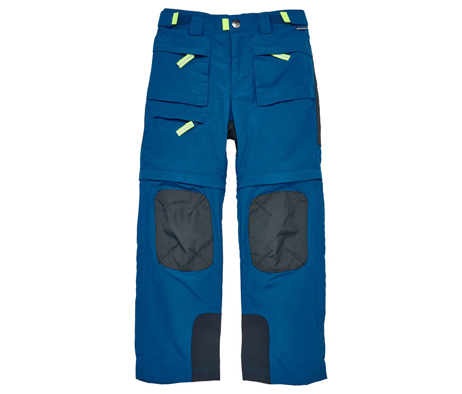 Le pantalon zippé JAKO-O, pétrole, est un pantalon long bleu avec des poches et des détails jaune néon.