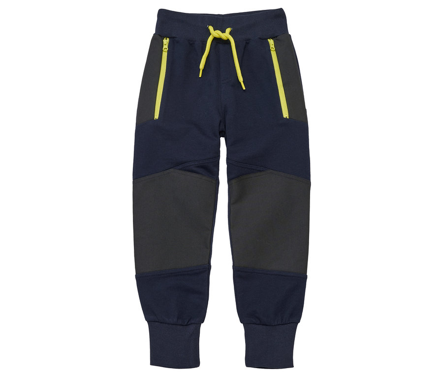 Pantalon marine pour enfant avec fermetures éclair et cordon de serrage jaunes.