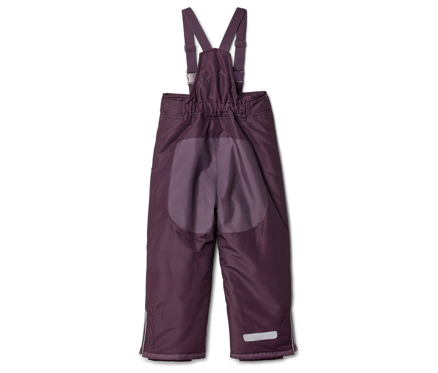 Pantalon de ski violet à bretelles avec détails réfléchissants au bas des jambes.