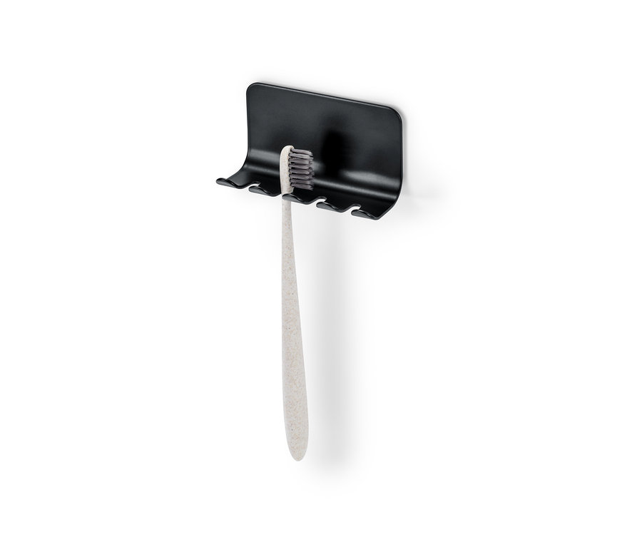 Porte-brosses à dents avec une brosse à dents.