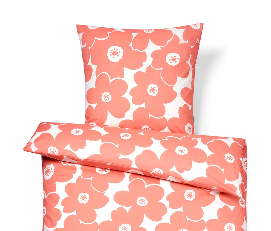 Parure de lit en coton corail avec motif floral.