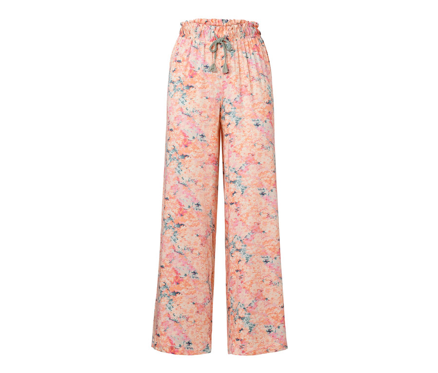 Pantalon relax abricot avec un motif floral.