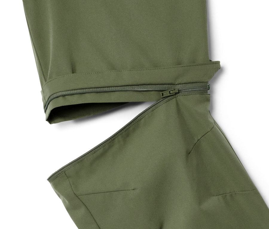 Détail d'un pantalon fonctionnel kaki 2 en 1 avec fermeture éclair.