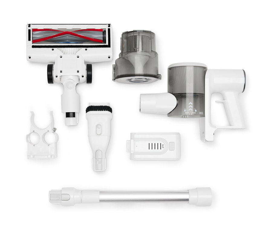 Un aspirateur sur batterie professionnel démonté avec divers accessoires sur fond blanc.