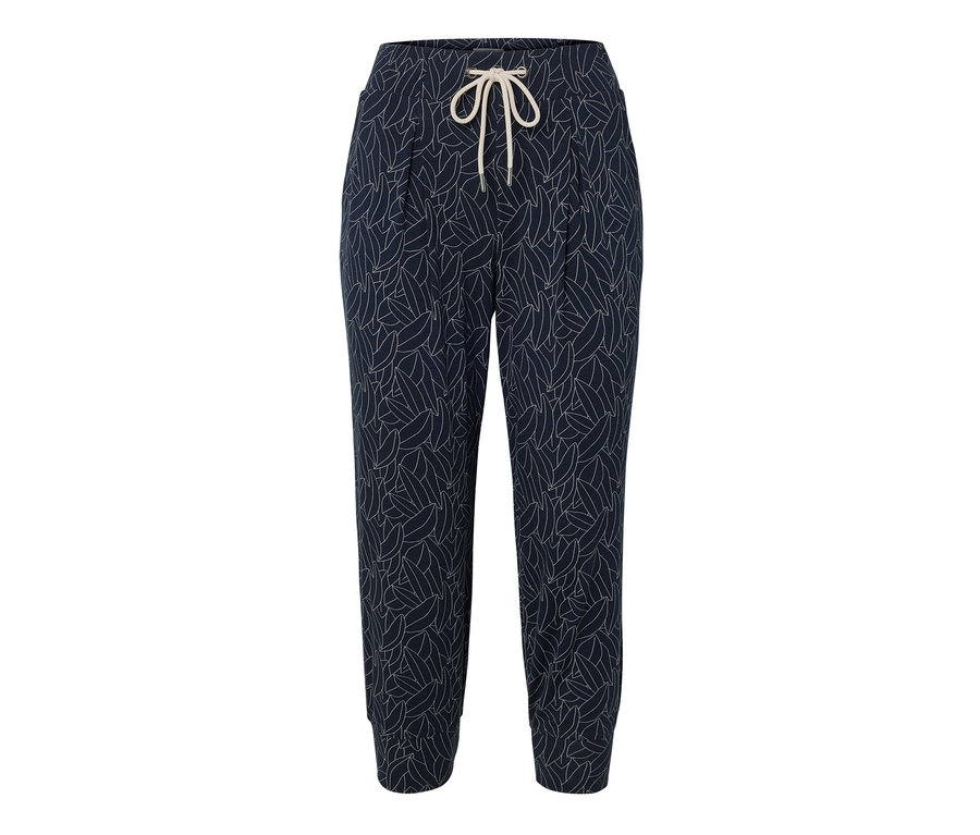 Un pantalon 3/4 en jersey bleu et blanc crème avec un motif de feuilles et un cordon de serrage.