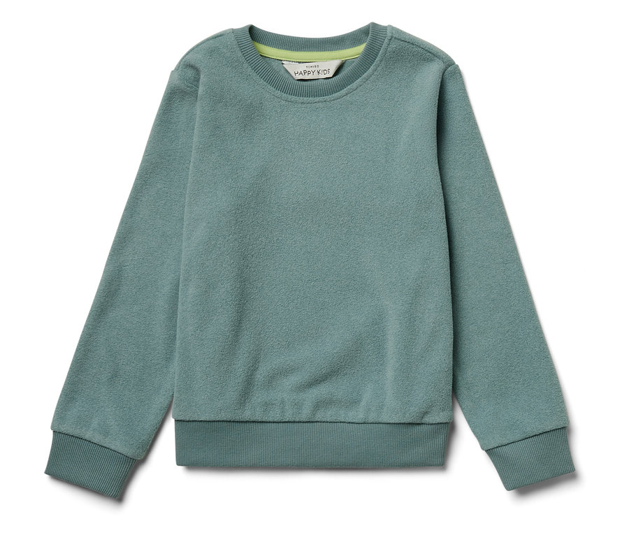 Un sweat-shirt vert posé sur un fond blanc.