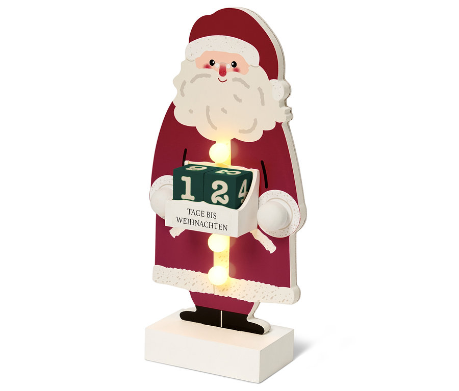 Une figurine de Père Noël en bois avec un calendrier de l'Avent.