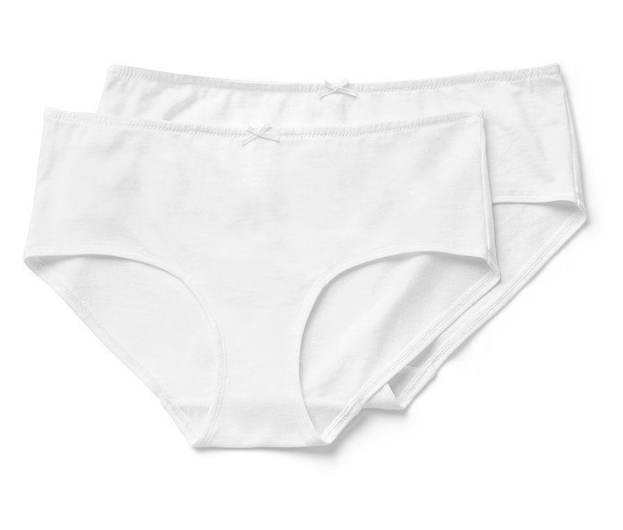 Deux culottes blanches en coton avec un nœud couché l'une sur l'autre.