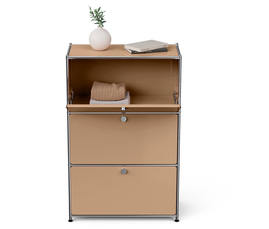 Un meuble beige ouvert avec deux tiroirs, un vase avec une plante et des livres sur le dessus.