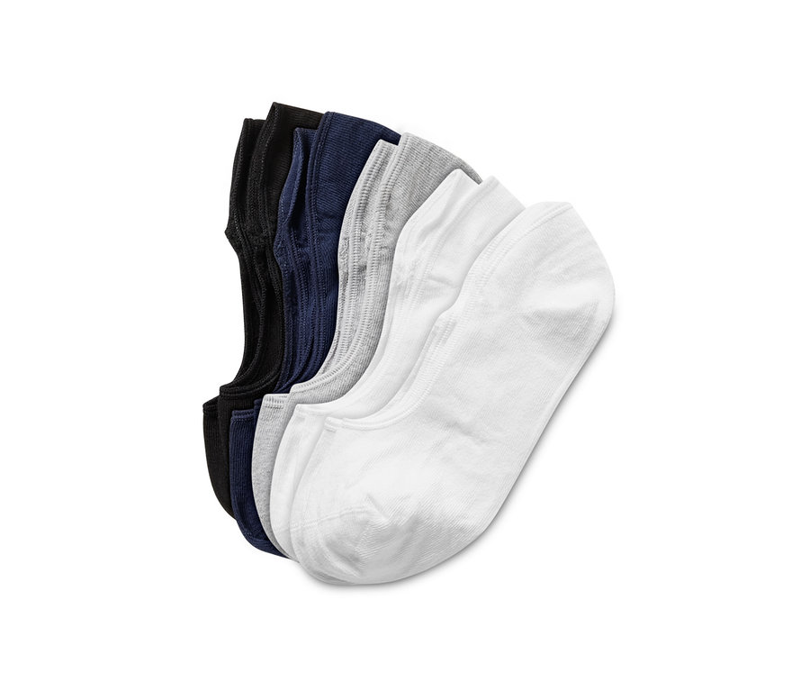 Cinq paires de socquettes noires, bleu marine, grises et blanches.