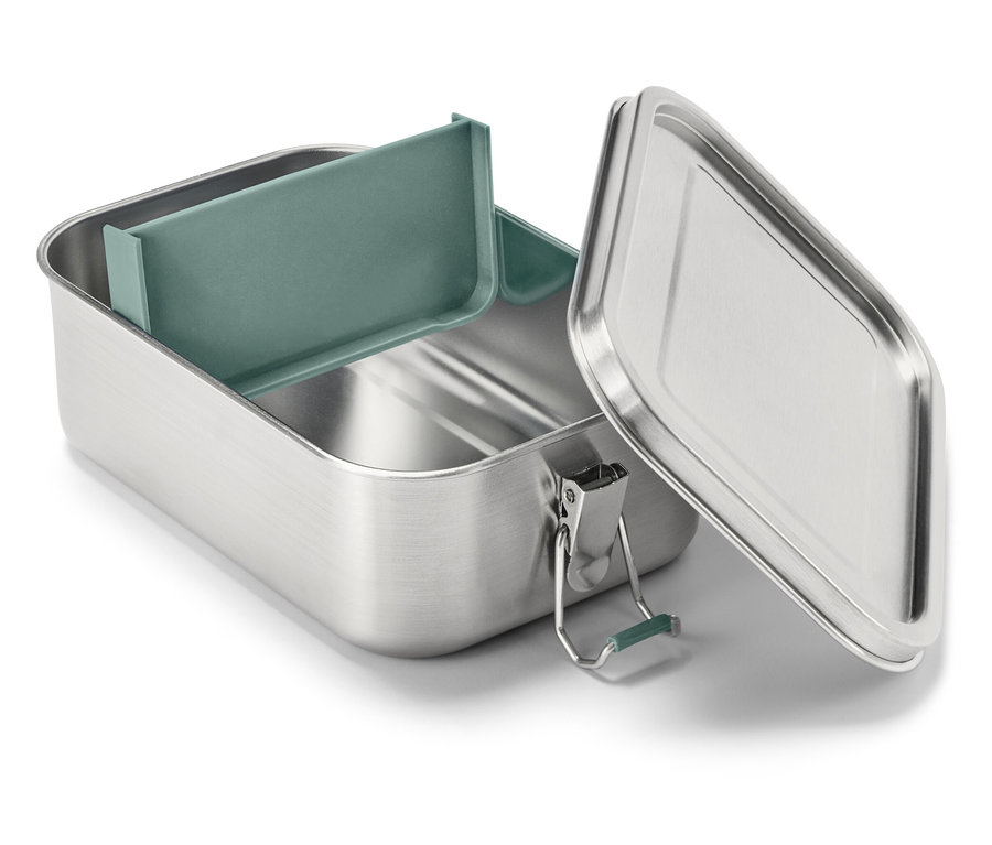 Une boîte à lunch ouverte et vide en acier inoxydable avec un insert vert.
