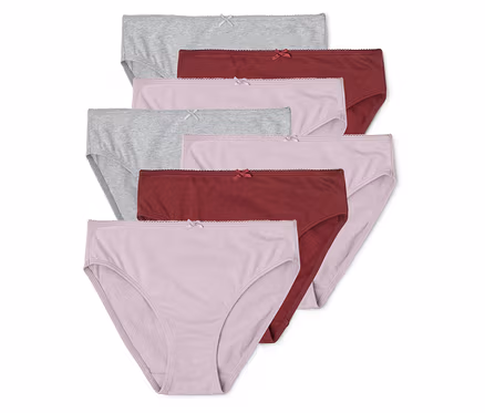 Pile de sept culottes en coton gris, rose et bordeaux avec un nœud sur fond blanc.