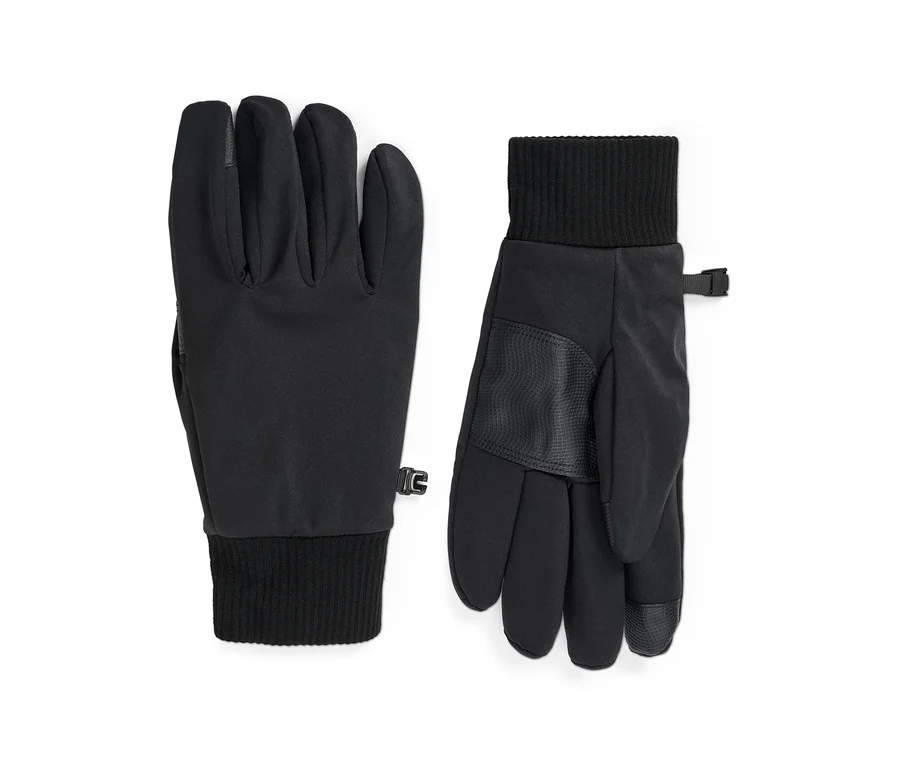 Une paire de gants en softshell noirs, l'un paume vers le haut et l'autre paume vers le bas, avec des poignets côtelés, des paumes texturées et de petits clips d'attache.