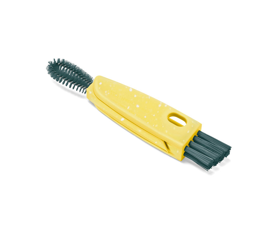 Brosse multifonction 3 en 1 jaune avec des taches blanches et des poils verts.