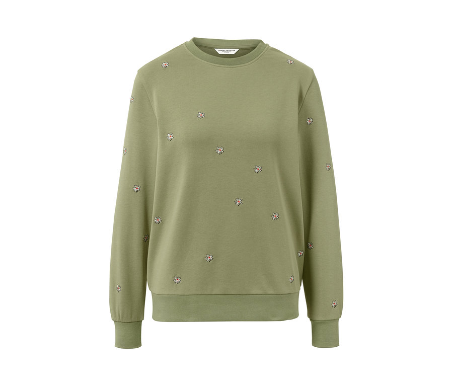 Sweat-shirt brodé vert avec des fleurs.