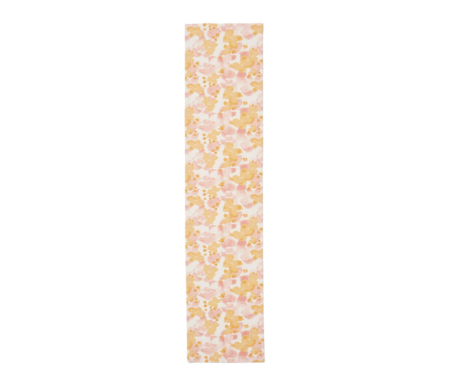Chemin de table à motif floral jaune et rose.