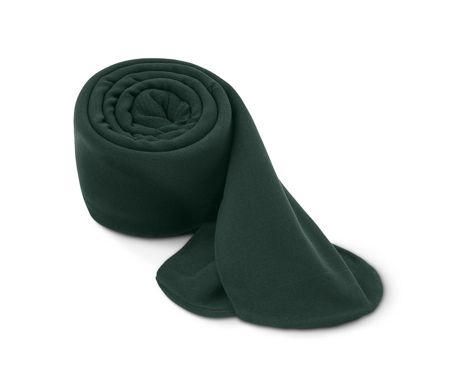 Un collant thermique enroulé sur un fond blanc.