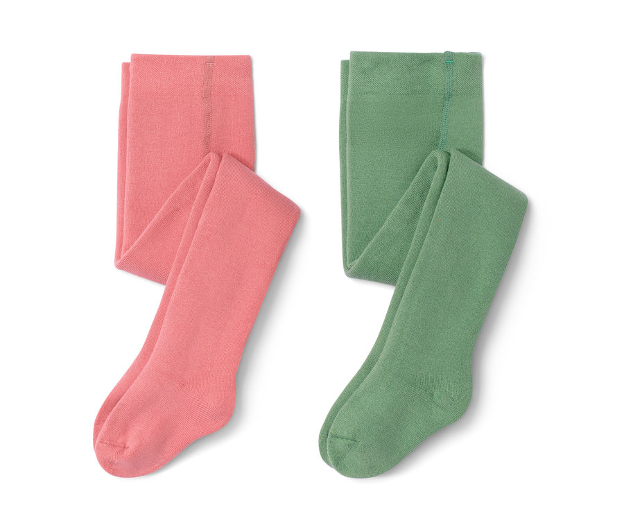 Deux collants thermiques pour tout-petit, un saumon et un vert, sont placés côte à côte.