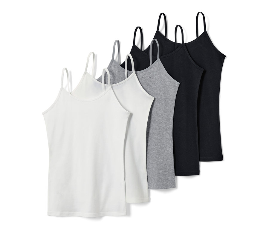 Cinq maillots de corps pour fille en blanc, gris et noir.