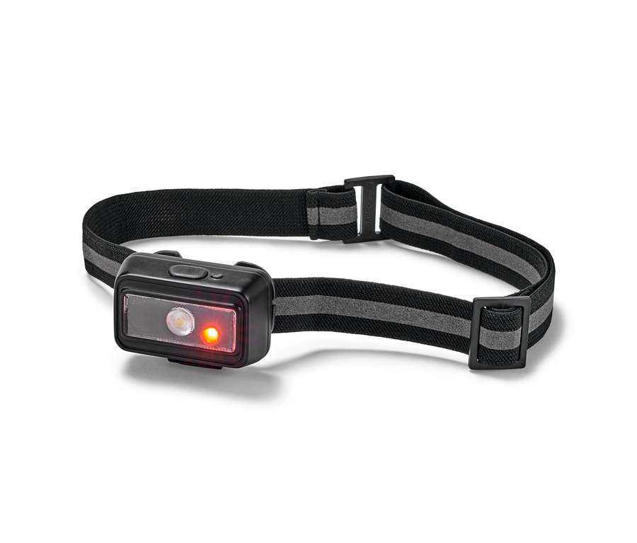 Gros plan d'une lampe frontale compacte avec un bandeau élastique noir et des lumières LED brillantes.