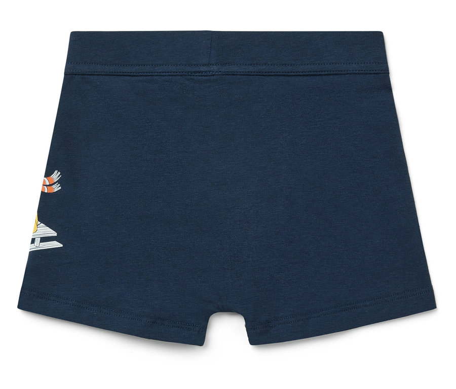 Boxer pour enfant bleu marine avec un motif de voilier sur le côté gauche.