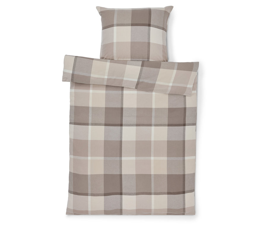 Housse de couette et oreiller à carreaux beiges.