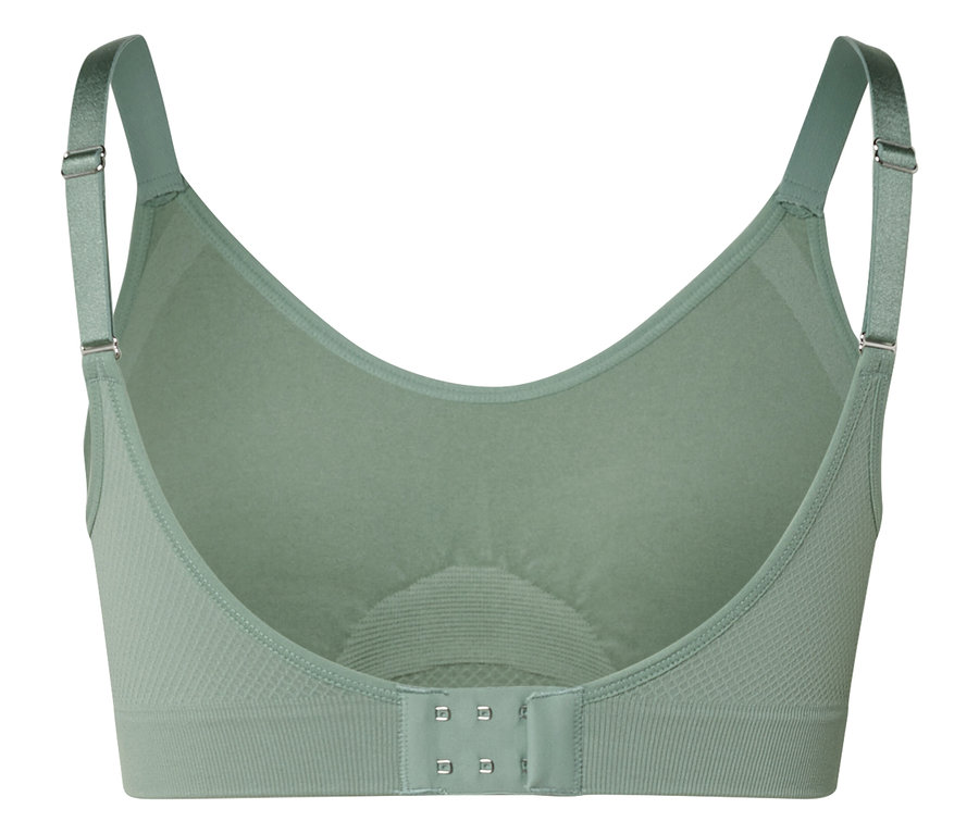 Gros plan de l'intérieur d'un soutien-gorge vert avec bretelles réglables et fermeture à agrafes.