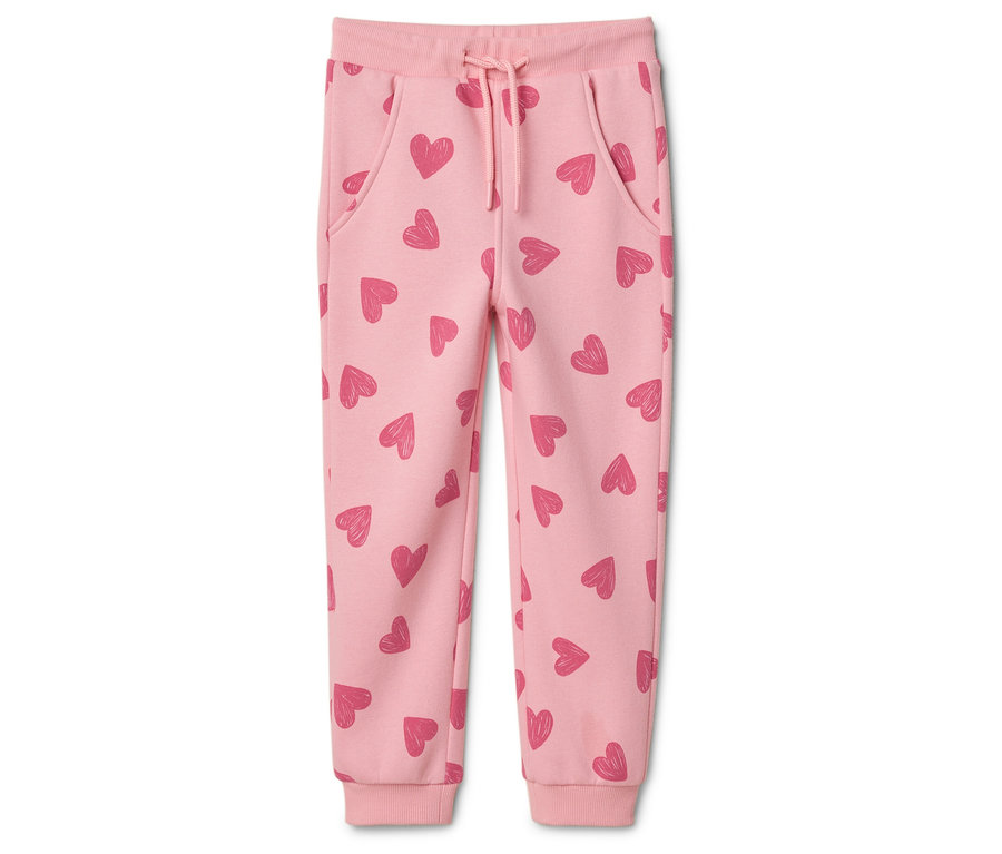 Un pantalon de jogging rose clair avec des cœurs roses et un cordon de serrage.