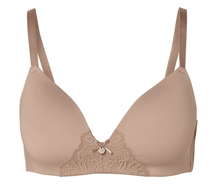 Un soutien-gorge beige avec de la dentelle et un petit nœud au centre.