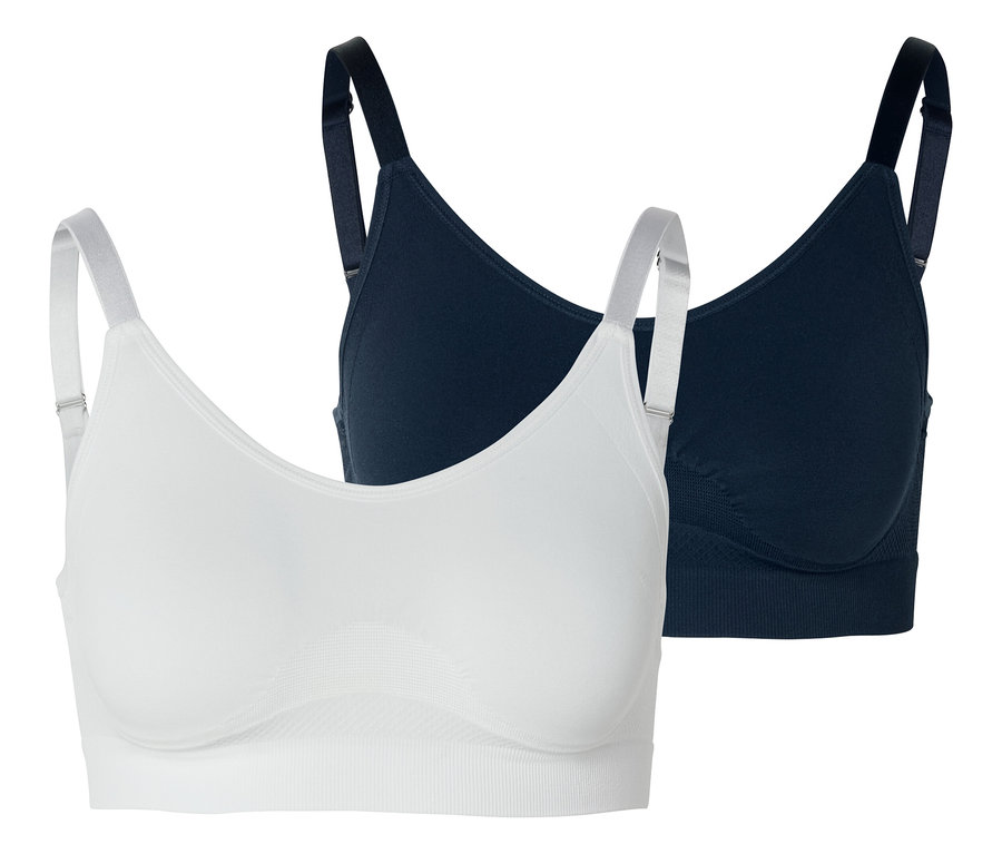 Deux soutiens-gorge, un blanc et un bleu marine, sur fond blanc.