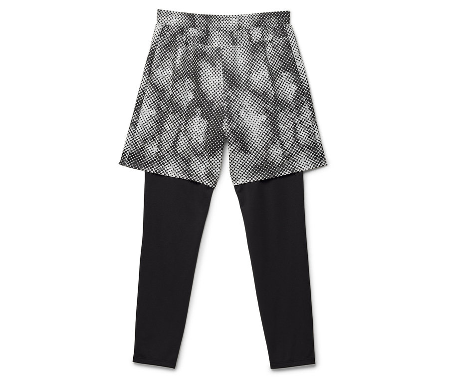 Leggings noirs avec jupe à pois superposée.