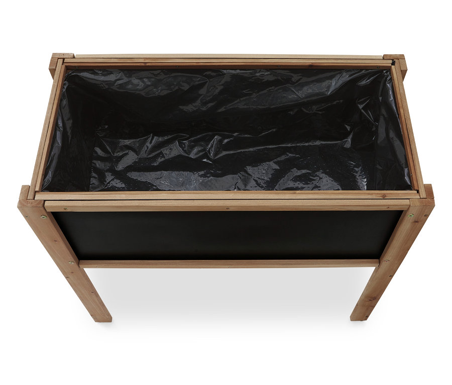 Vue de dessus d'un bac à plantes rectangulaire en bois vide, doublé d'une feuille noire.