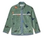 Veste en polaire verte zippée avec motif dinosaure, bordée d'un tissu bleu clair.
