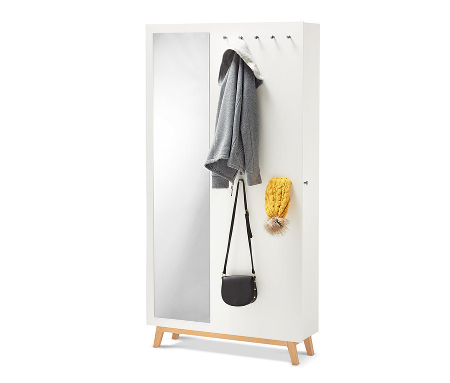 Meuble d'entrée multifonctionnel blanc avec miroir, veste, sac à main et bonnet.