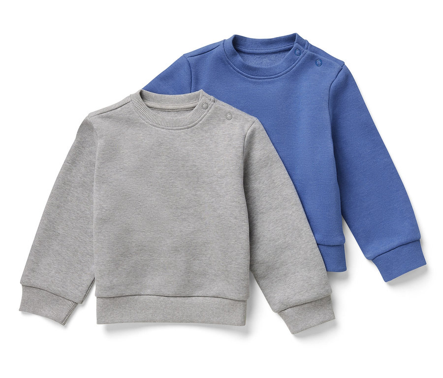 Deux sweatshirts pour enfant avec intérieur gratté, un gris et un bleu, sont posés l'un sur l'autre.