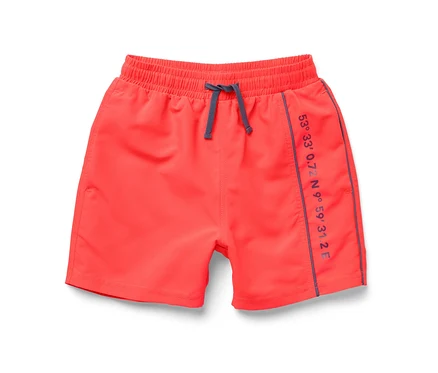 Short de bain enfant rouge avec taille élastique et cordon de serrage.