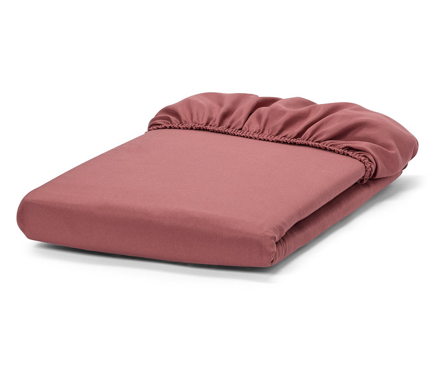 Drap-housse rose plié.