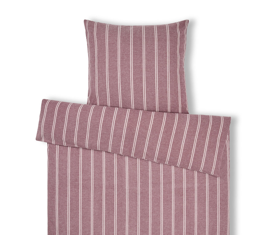 Linge de lit rayé avec oreiller.