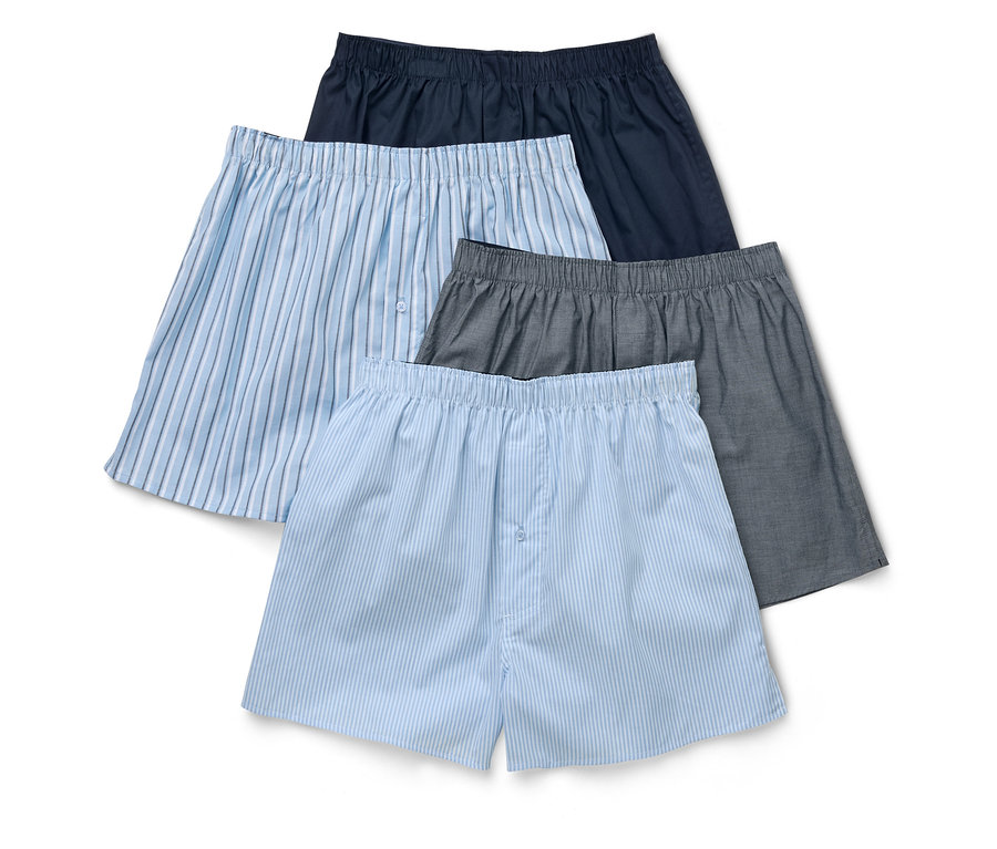 Vue de dessus de quatre boxers pour hommes bleu marine, gris et bleu clair rayé.